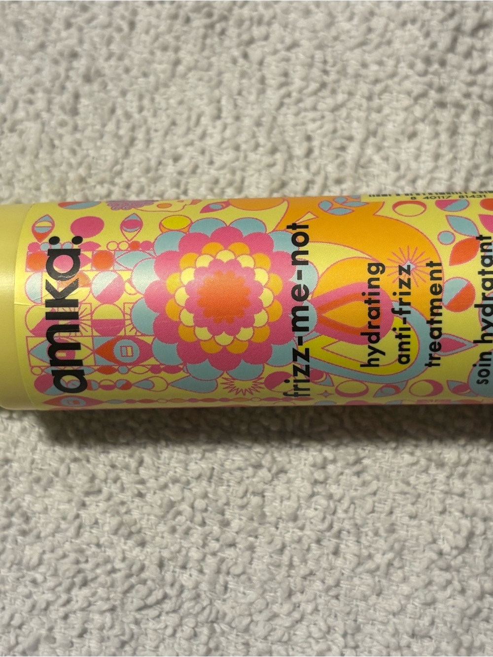 amika Hydrating Anti-Frizz Treatment Spray in Yellow with Pink and Blue Accents